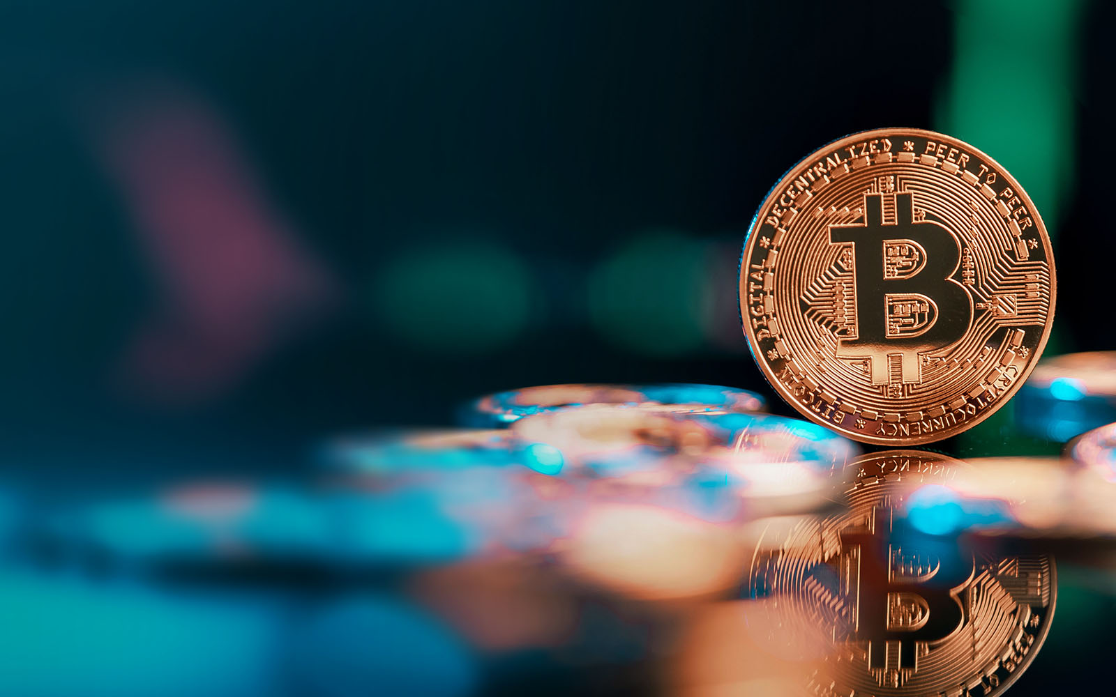 bitcoin with colorful blurred background and reflection