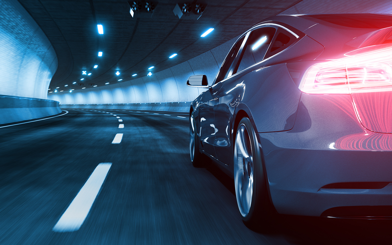 Une voiture électrique moderne traverse un tunnel avec un style de lumière bleue froide
