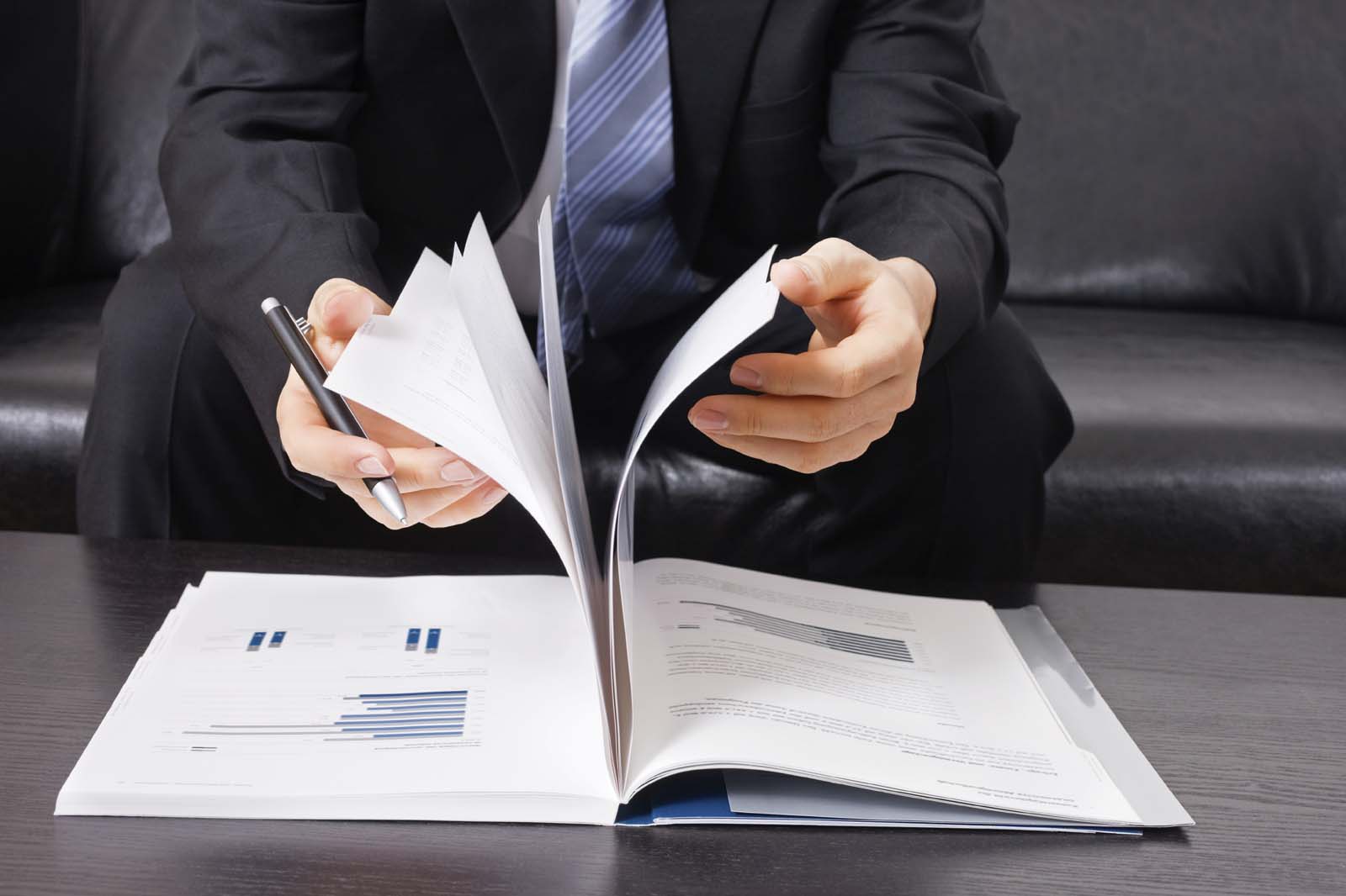 office person flipping through documents