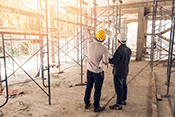 two workers in a construction site