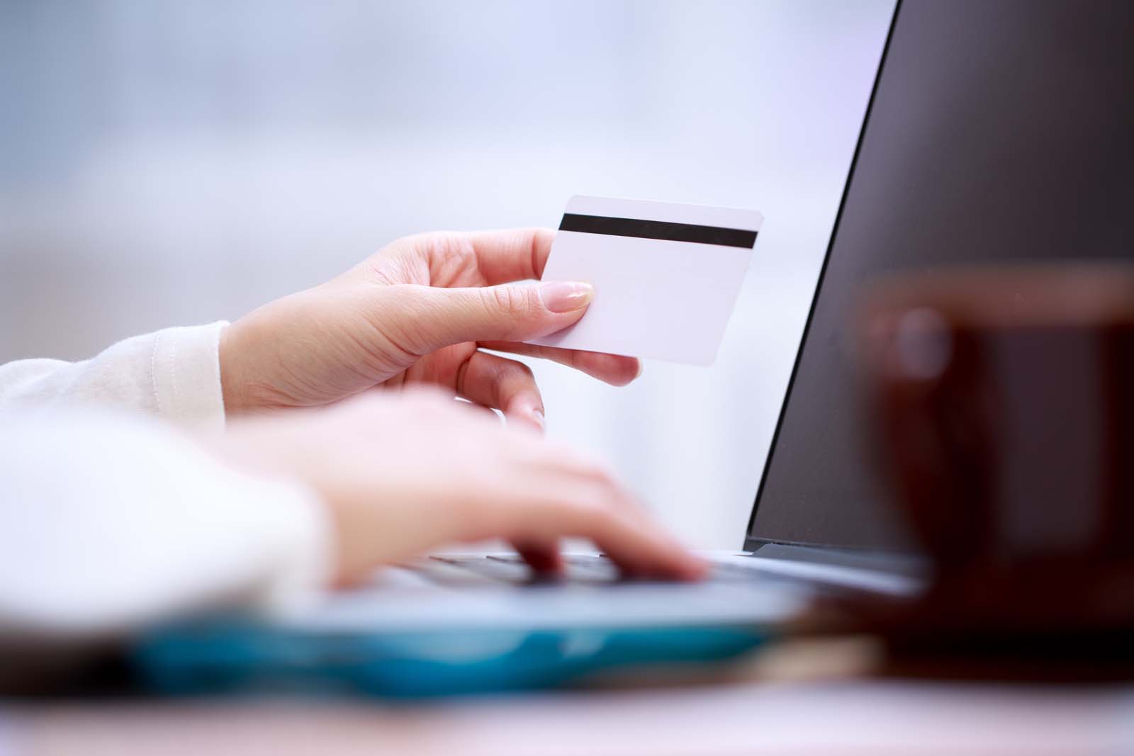 person holding a credit card