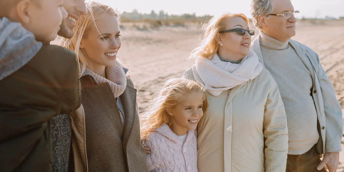 family posing for a photo in an outdoor setting