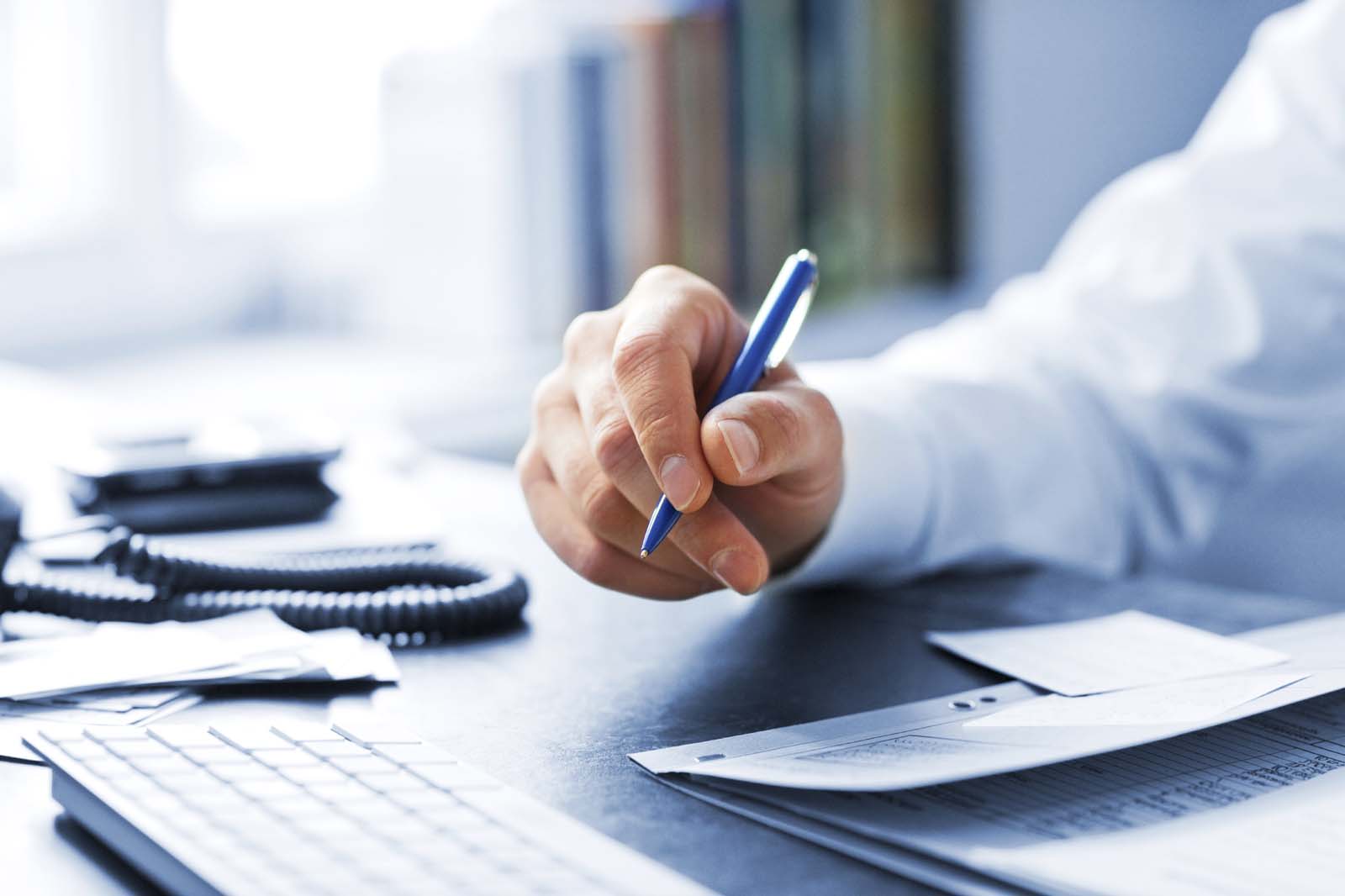 person holding a pen