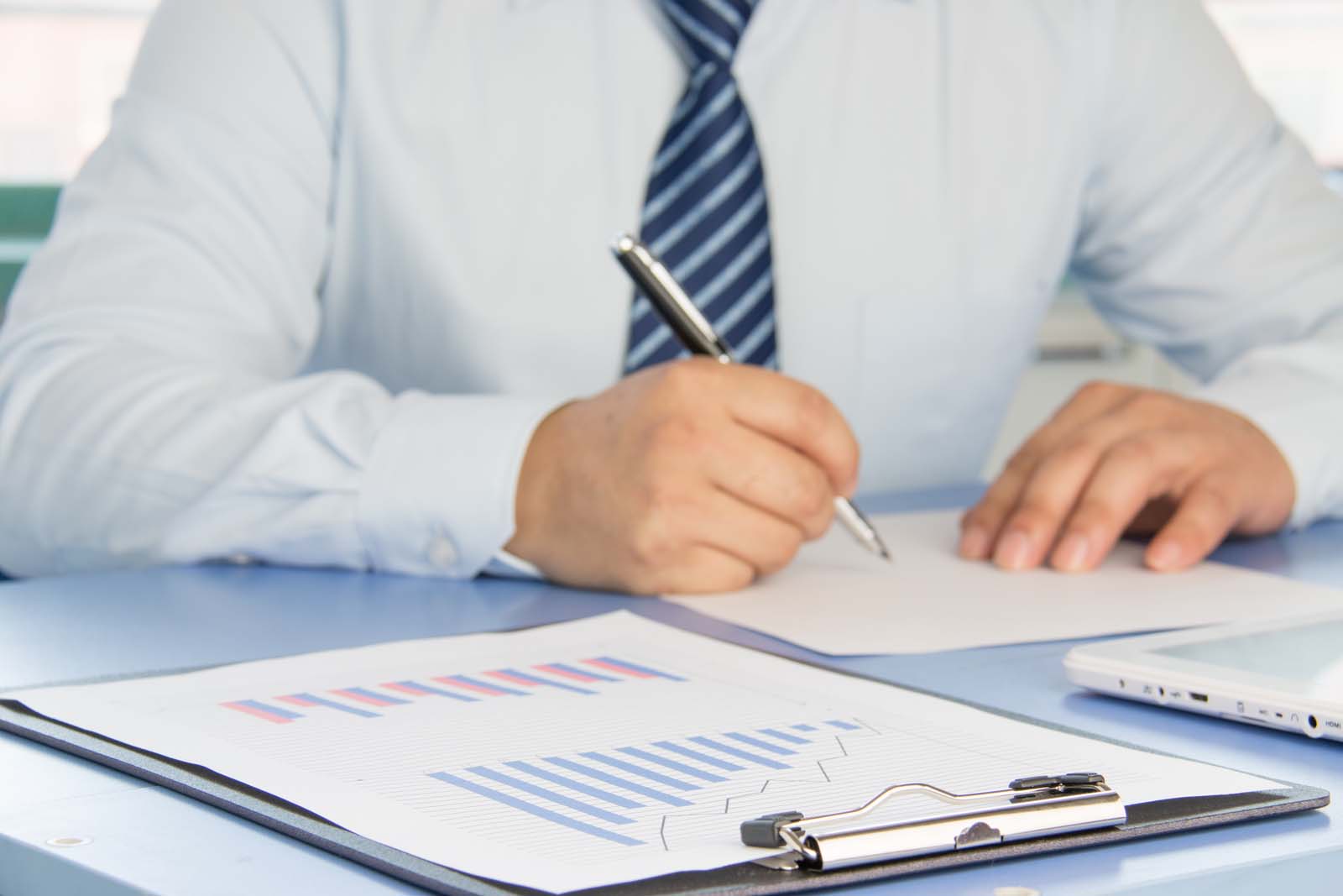 person working on paperwork in an office