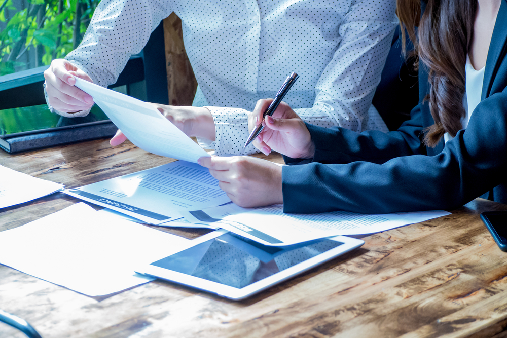 two people working on paperwork