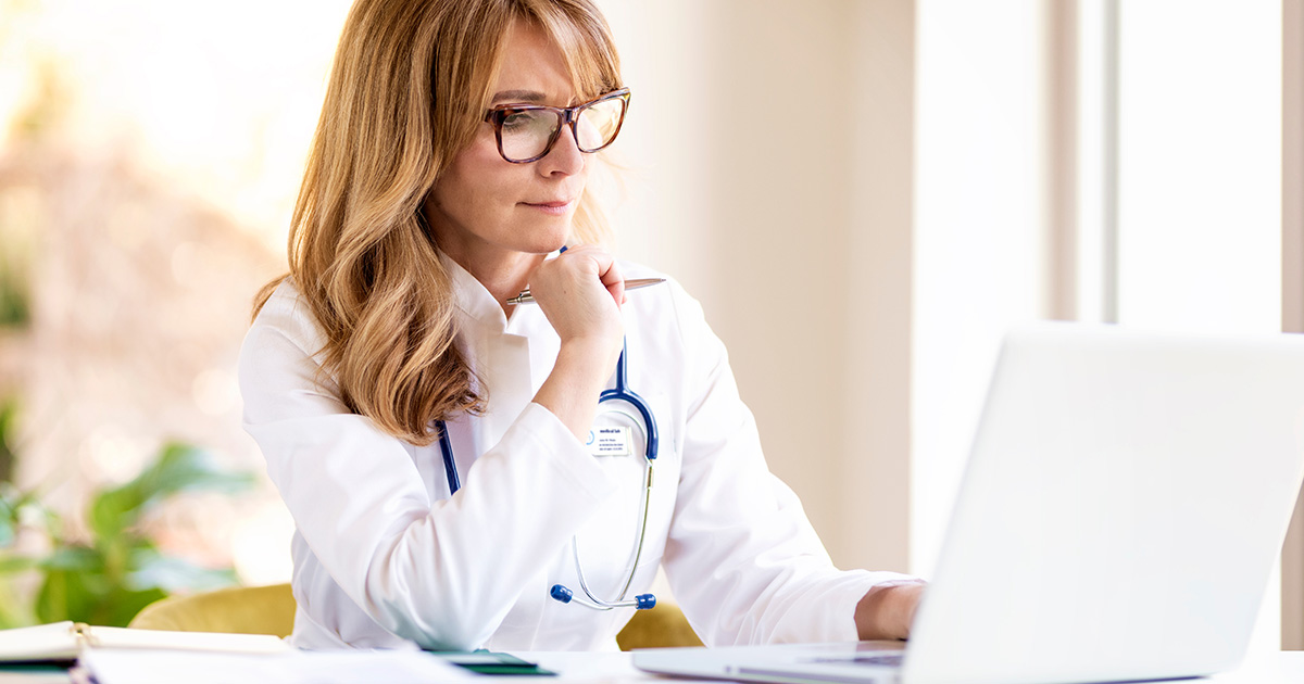 doctor working on a laptop