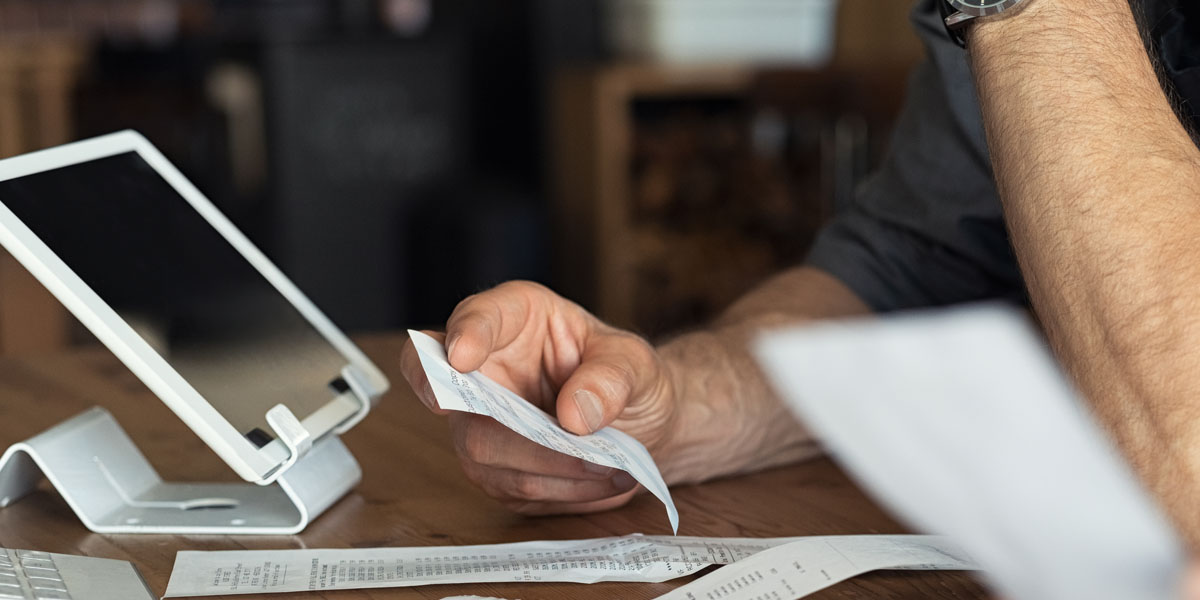 person looking at a receipt 