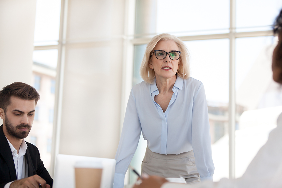 People talking around a table in a boardroom