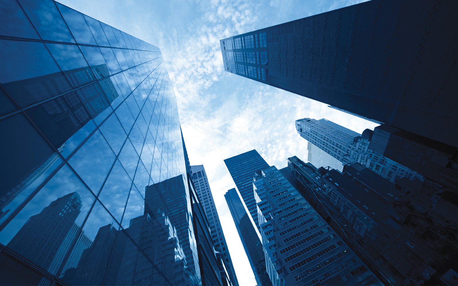 image from the ground looking up at sky scrapers