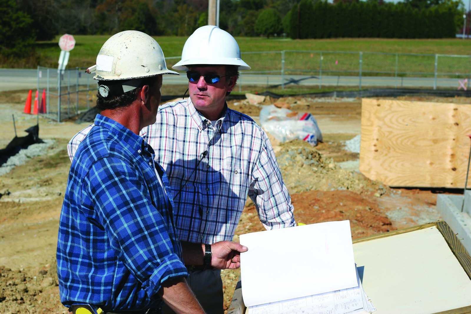 two people at a construction site