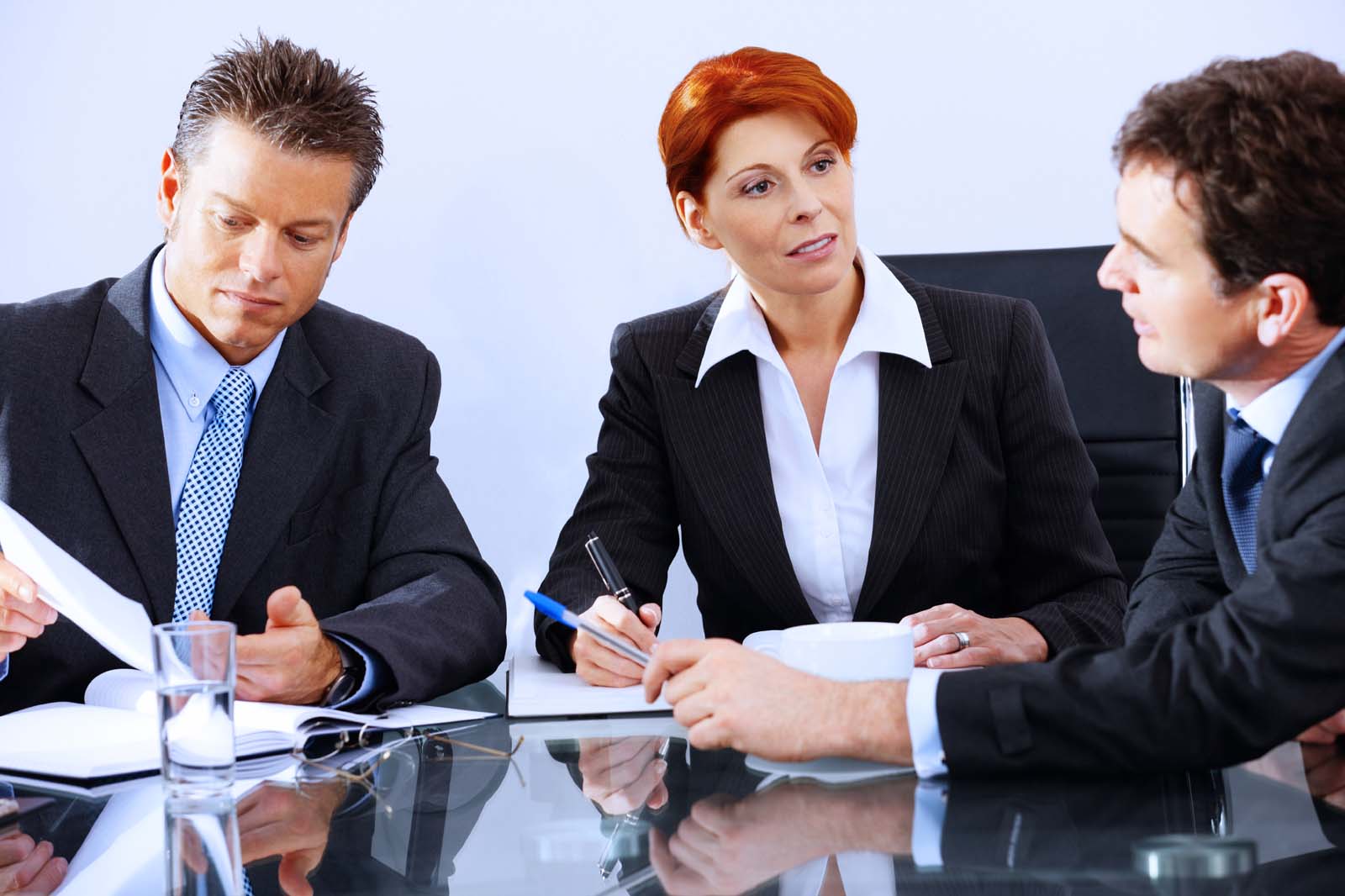 three people in a meeting