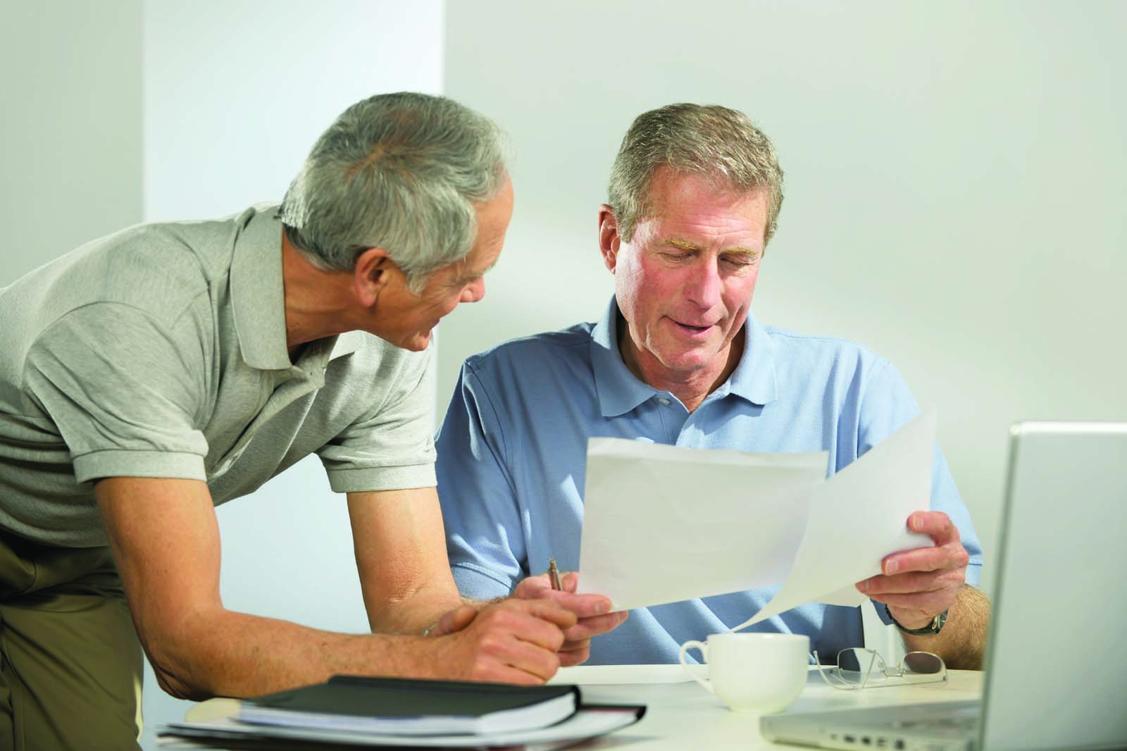 two people reviewing documents together