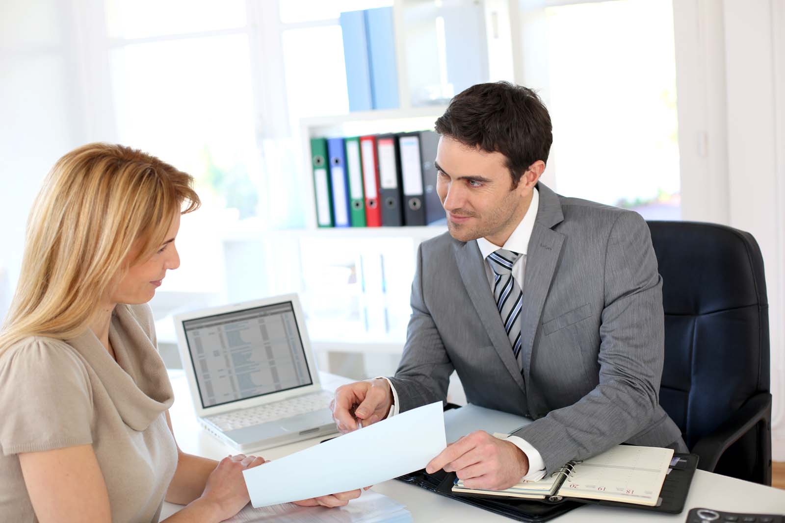 two people reviewing documents