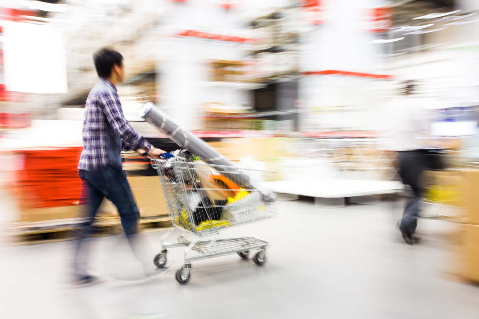 person pushing a shopping cart