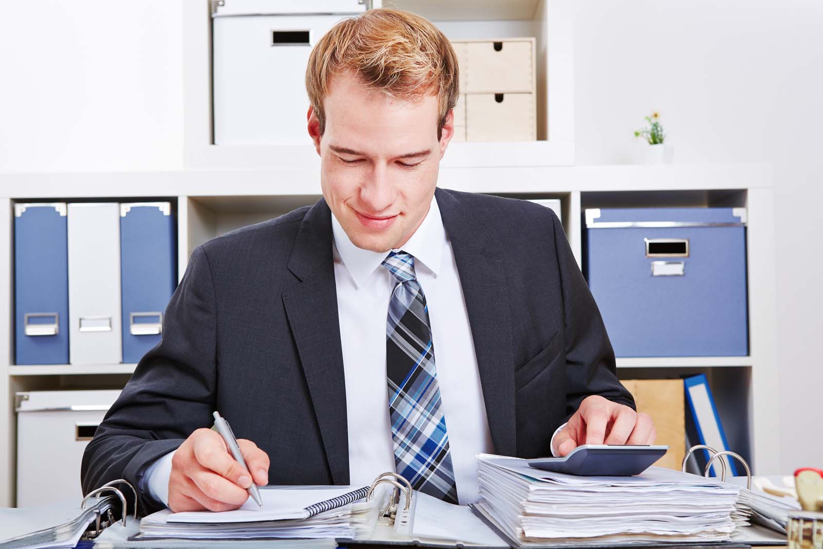 person writing in a notebook