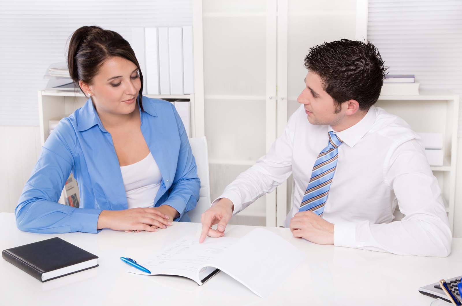 two people reviewing documents