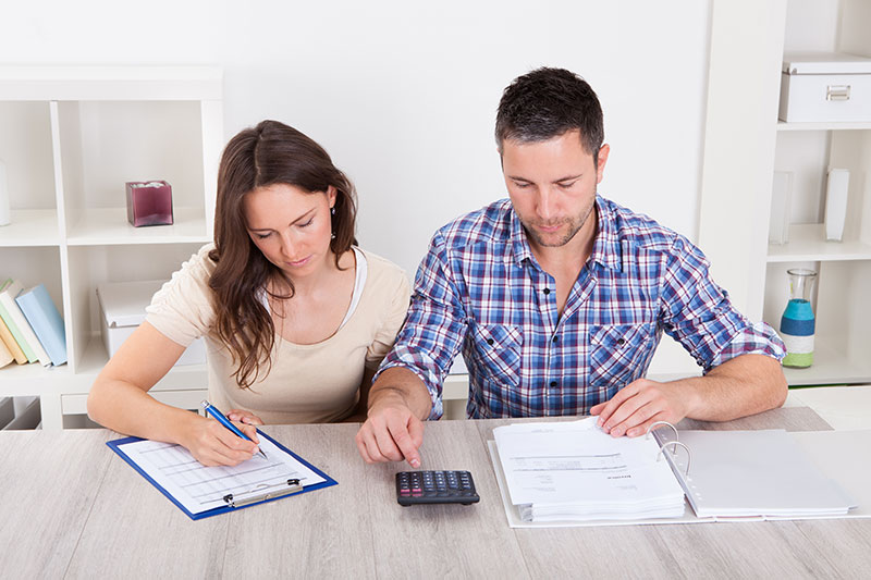 two people working on documents