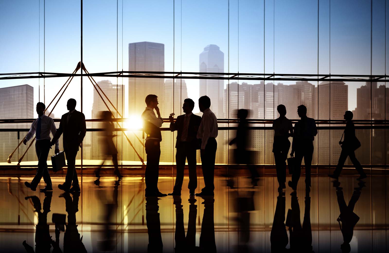 people in a crowded building in front of glass windows