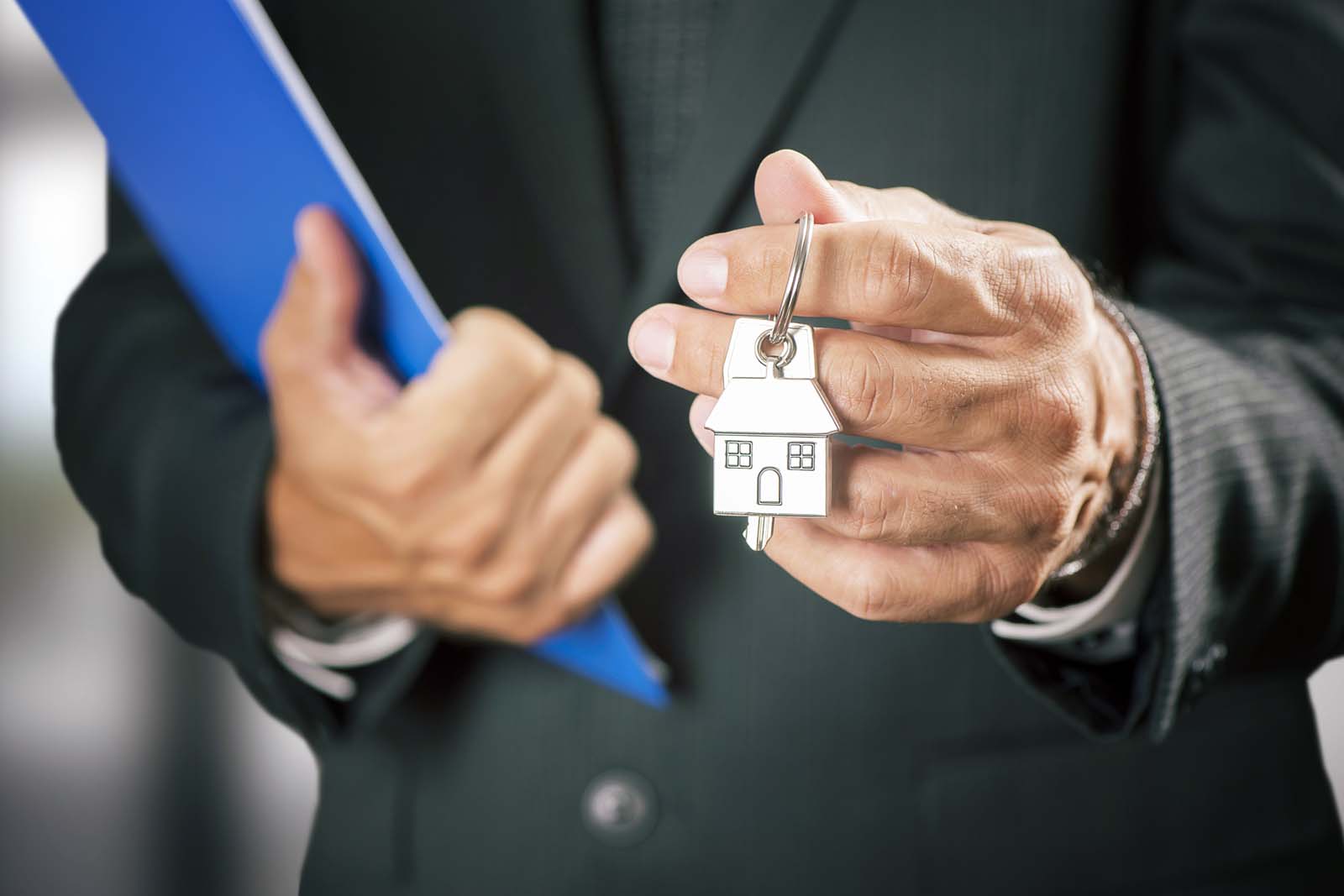 person holding a house key