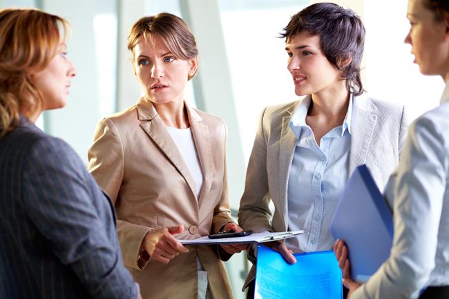 4 business women talking