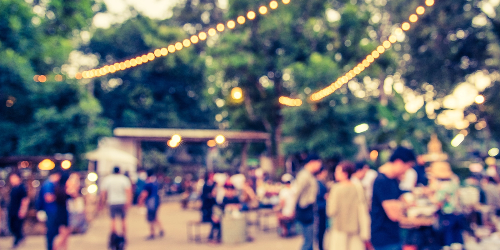 Outdoor gathering event with lots of poeple but the overall image is blurry