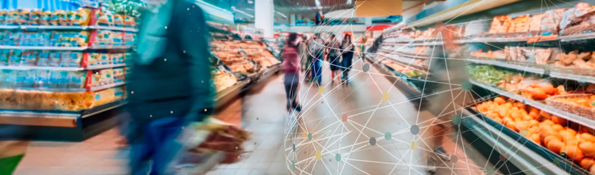 Blurred image of grocery shoppers at a grocery store.