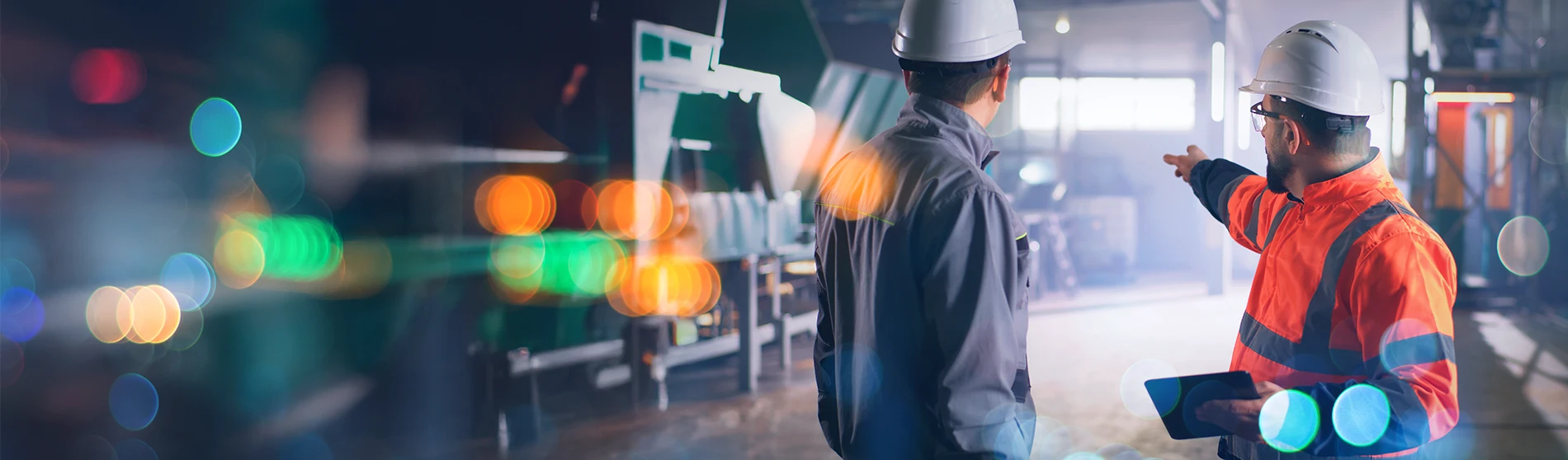 Workers collaborating in a manufacturing plant