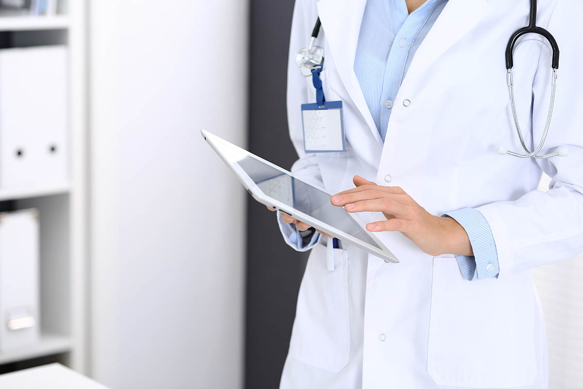 doctor holding an ipad