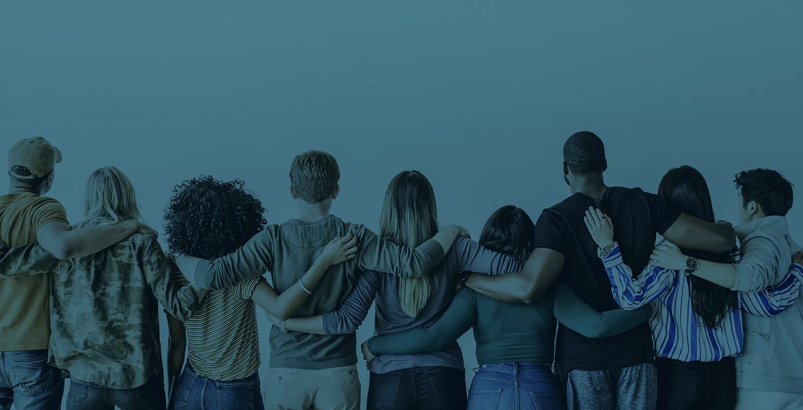 a group of volunteers with their arms around their backs