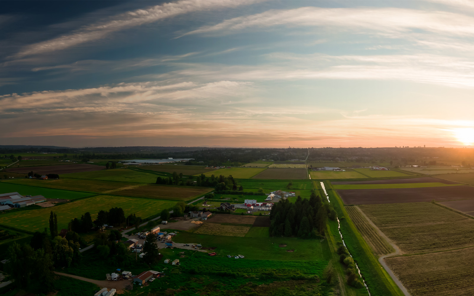 Birdseye view of a farm during sunset