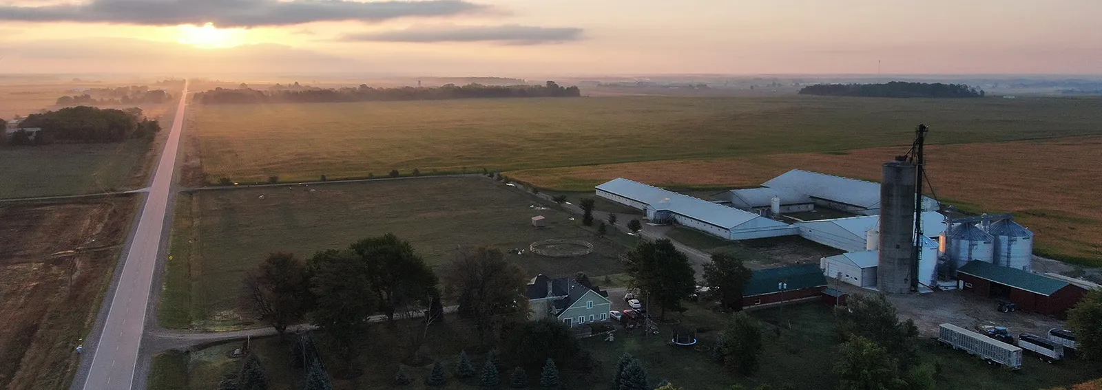 sunset over a farm field