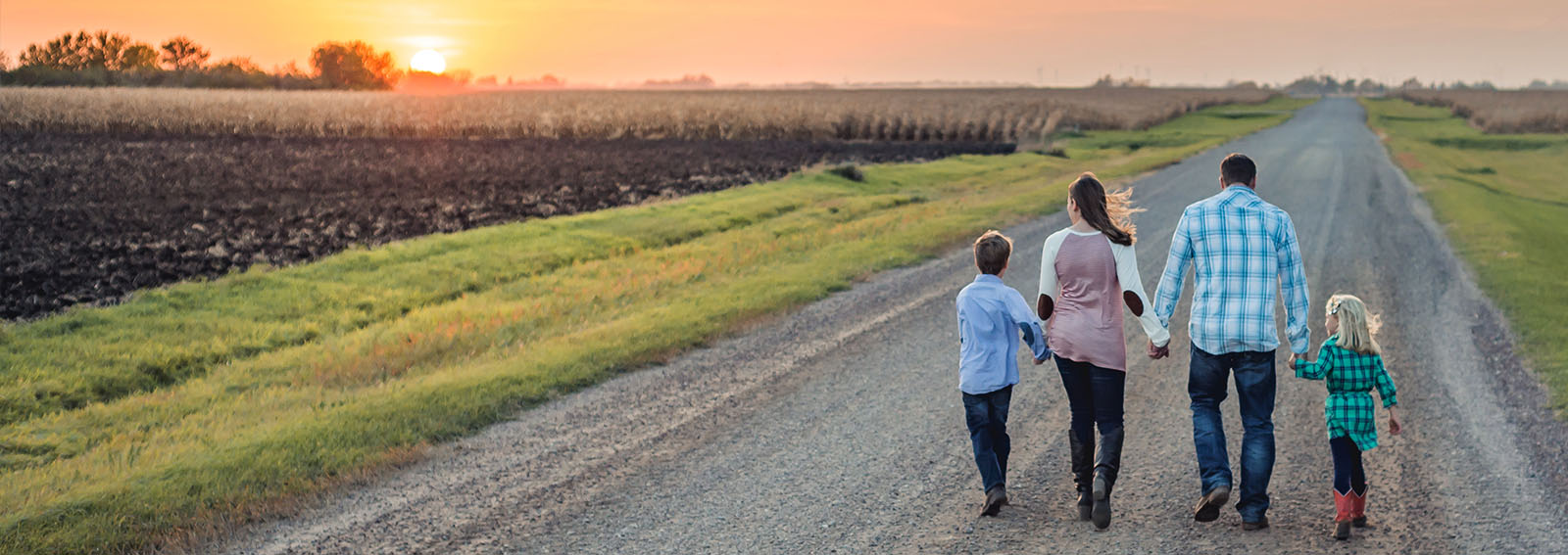 Farm Family walking down rural road