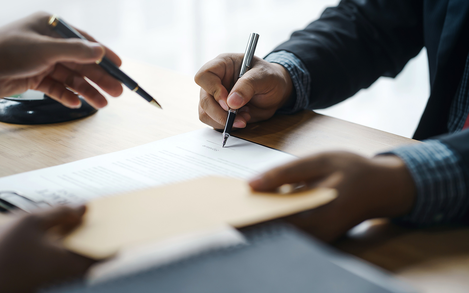 Two people reviewing a legal document