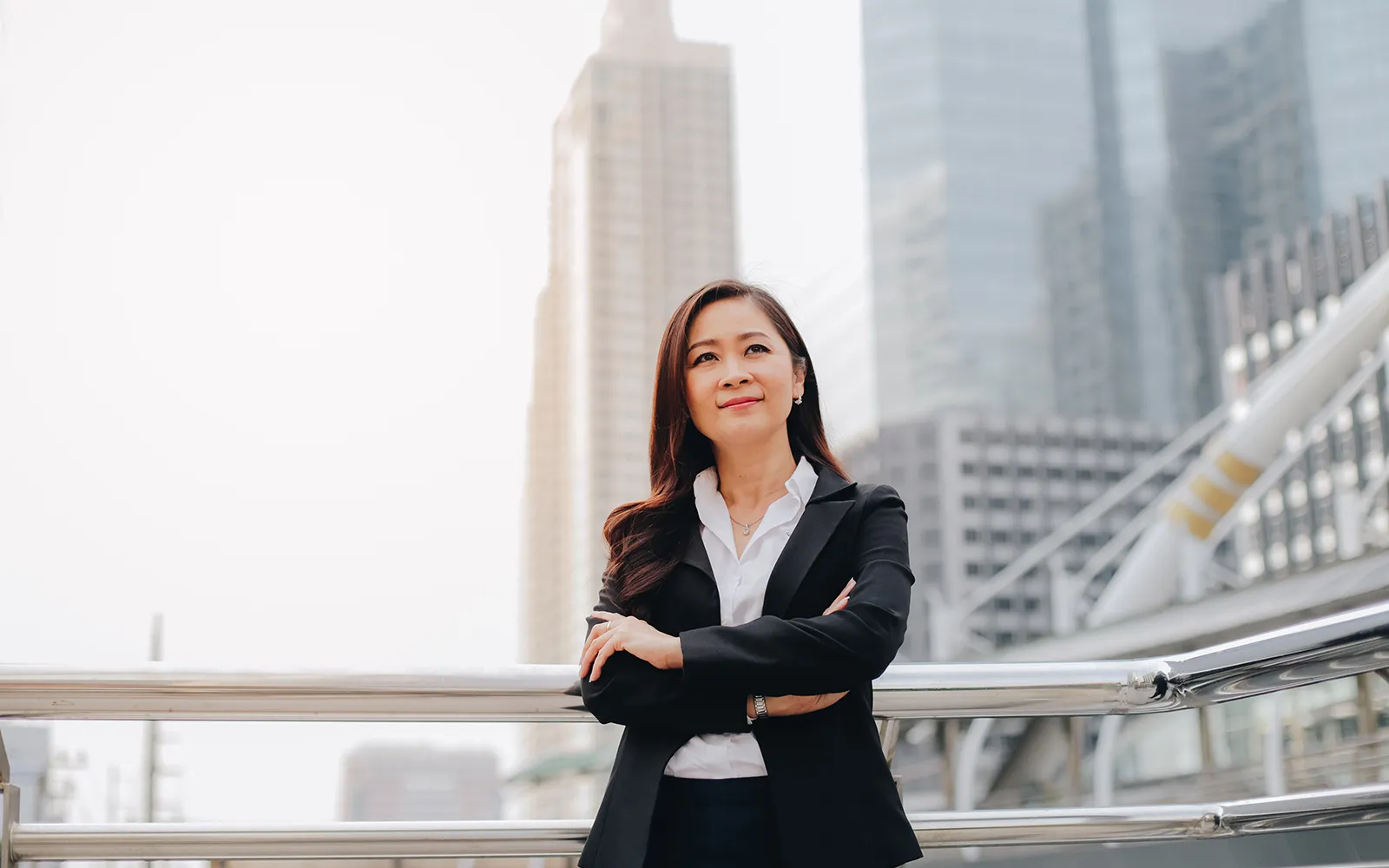 Woman standing in front of a cityscape