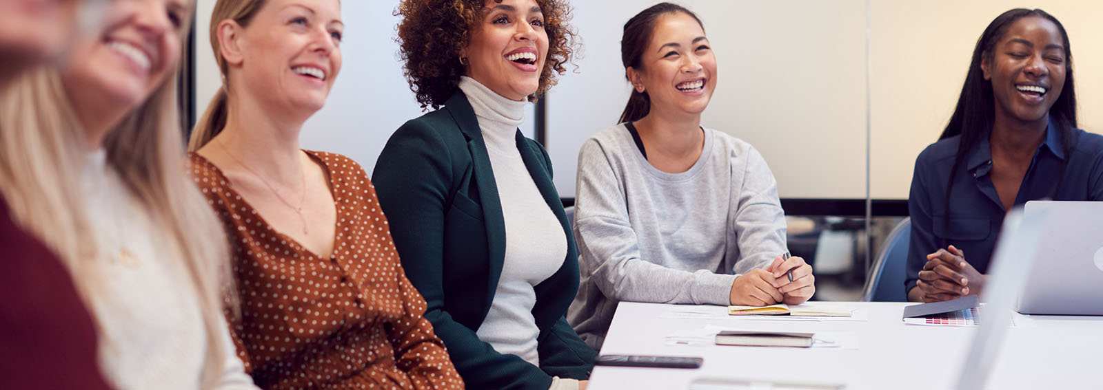 Group of female business leaders having a discussion.