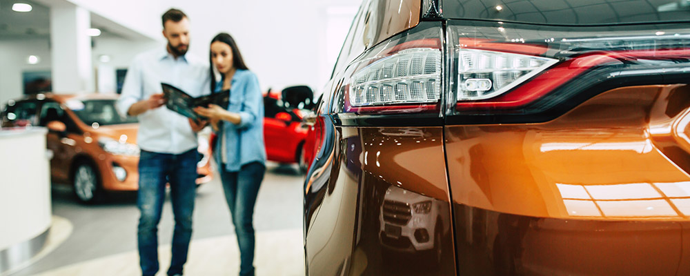 two people at dealership