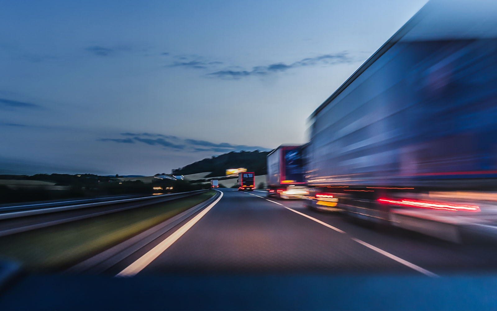 transport trucks driving down highway