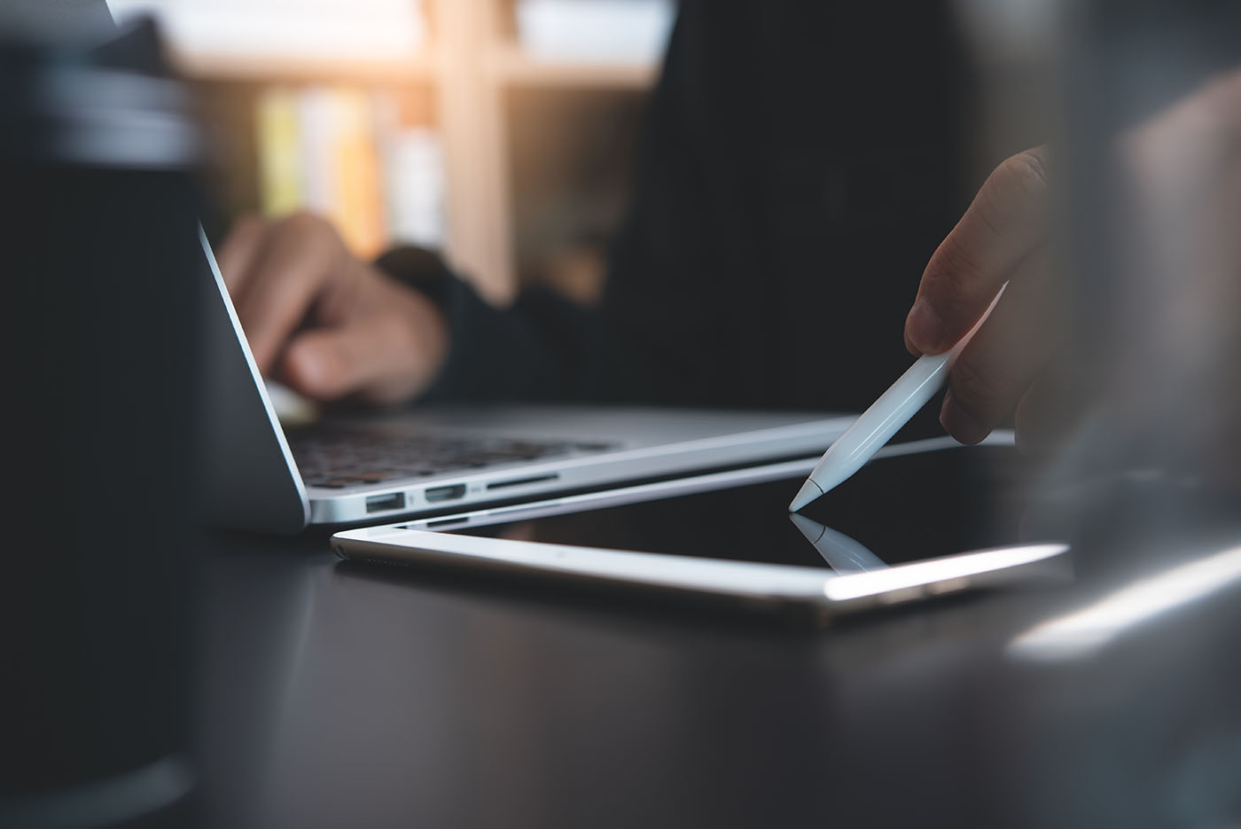 Person on computer and tablet