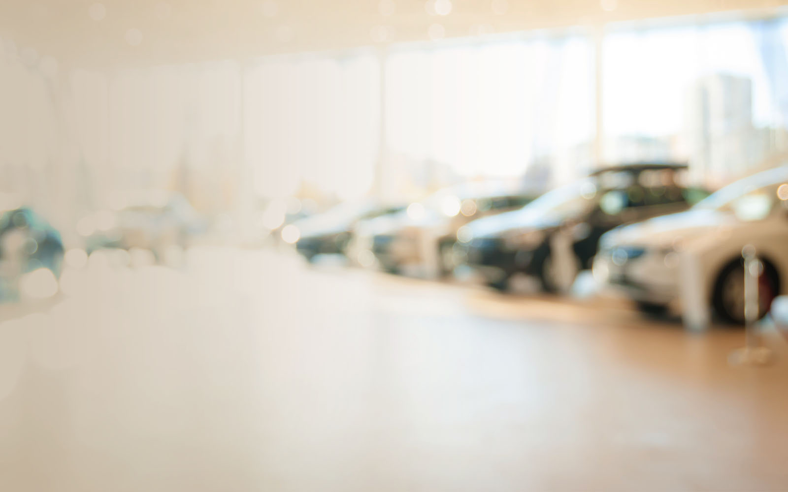 Blurred dealership with the cars and soft lightning