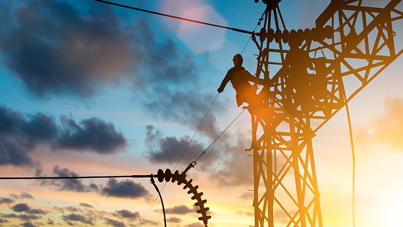 Worker on an electricity tower 