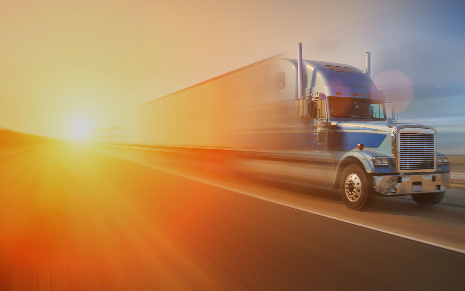 transport truck driving on a highway