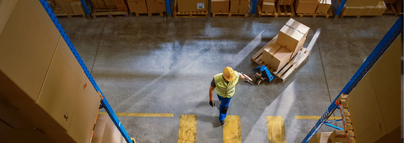 warehouse worker moving product for inventory management