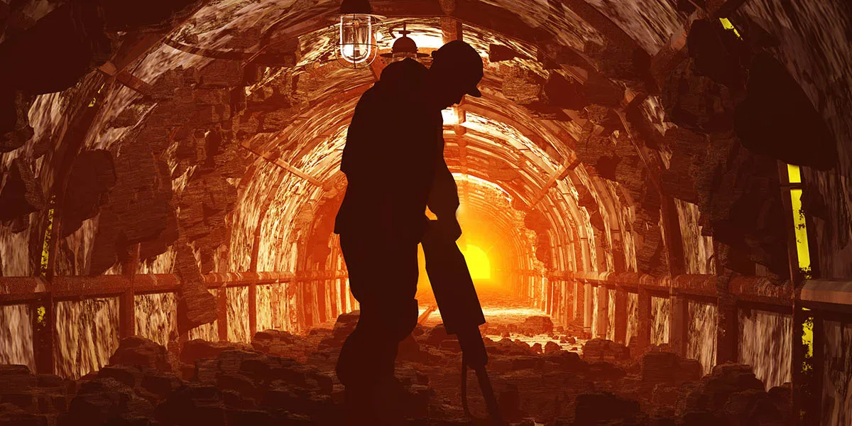 Man in a mine drilling