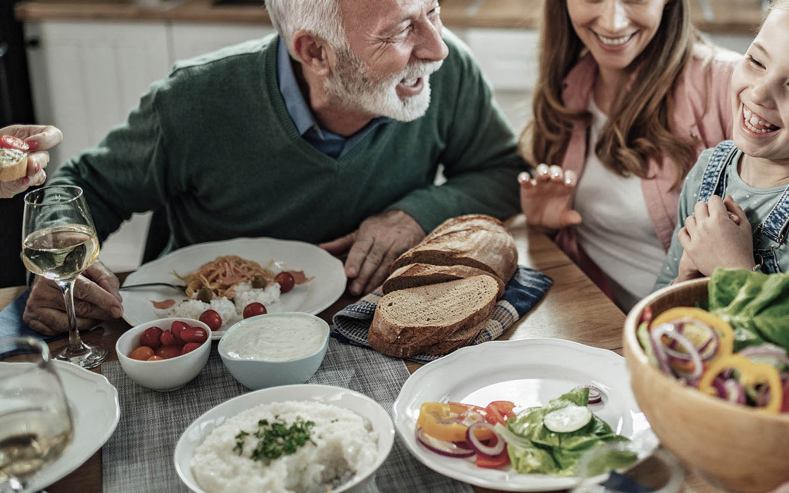 a family having dinner and discussing family office options