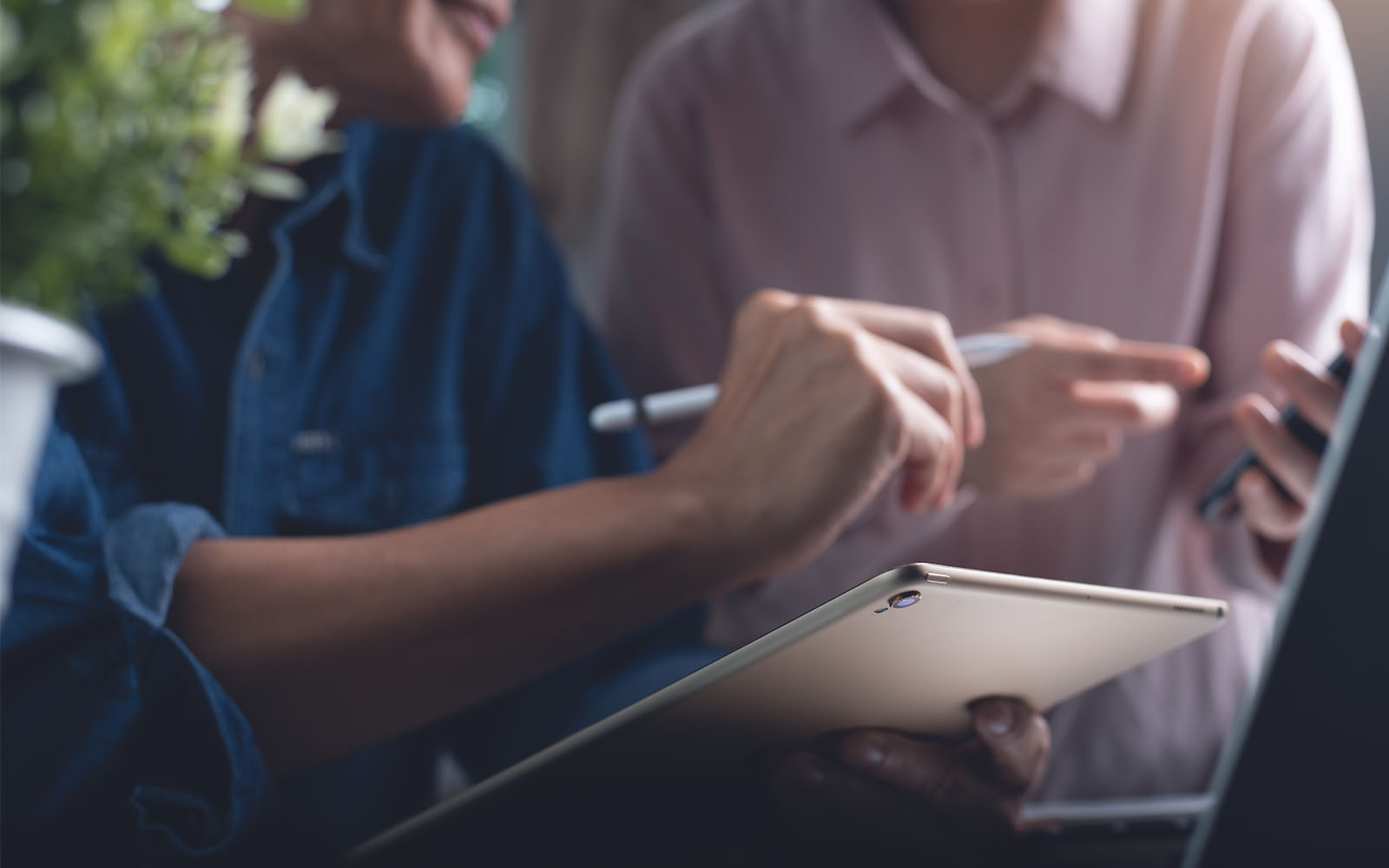 Hands holding a tablet