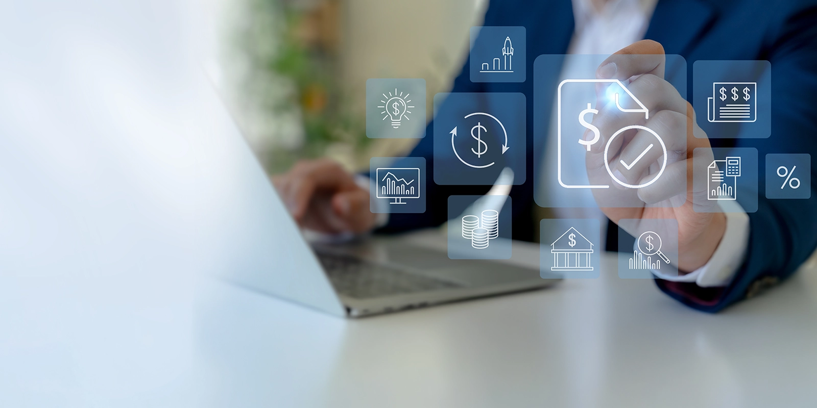 Financial services icons over a laptop user.