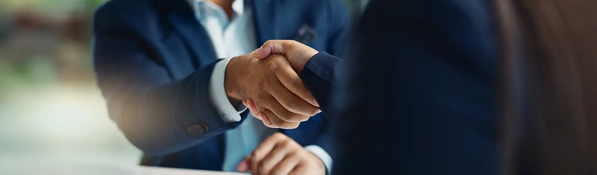 Business people negotiation and handshake for deal agreement