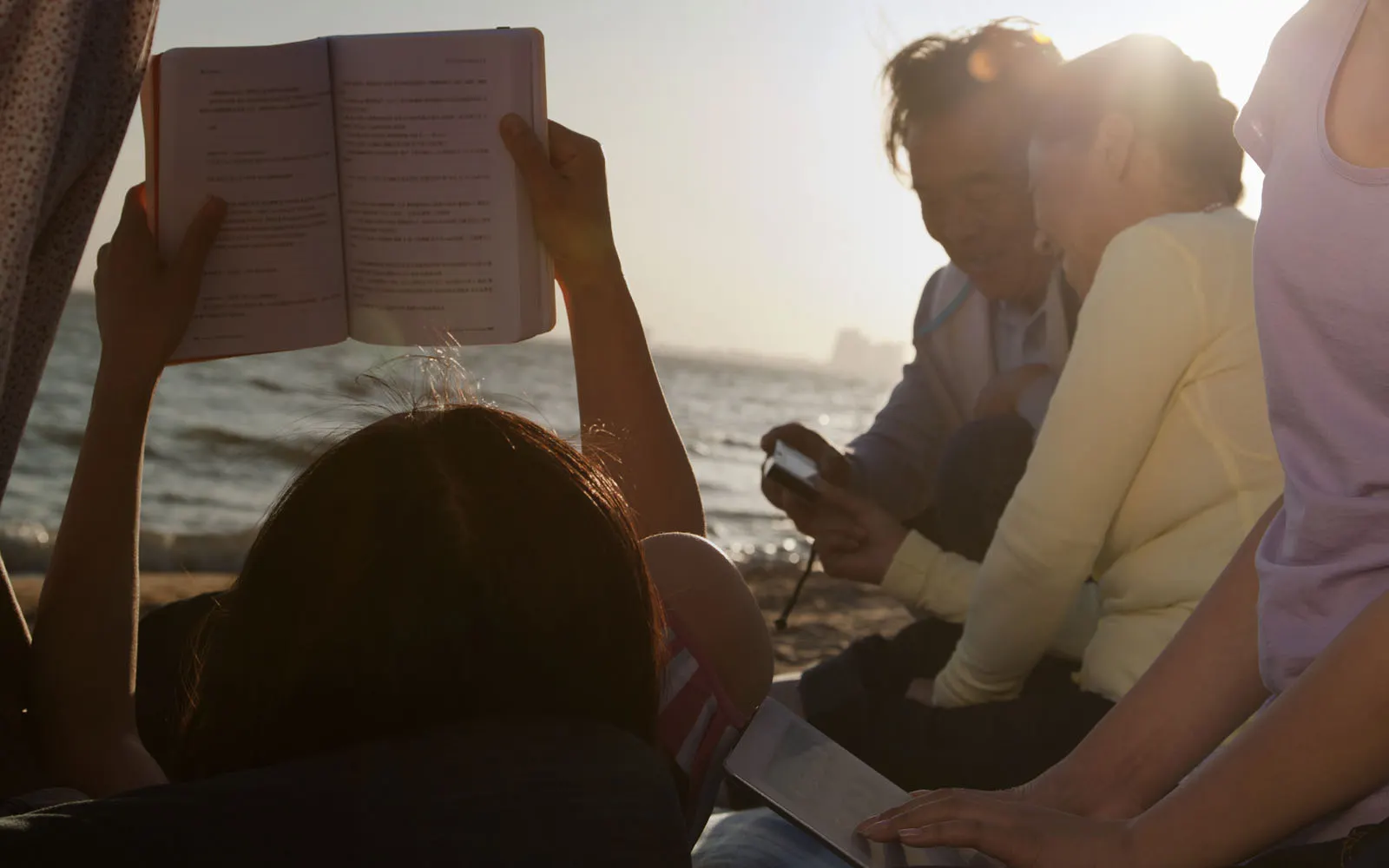 family enjoying beach