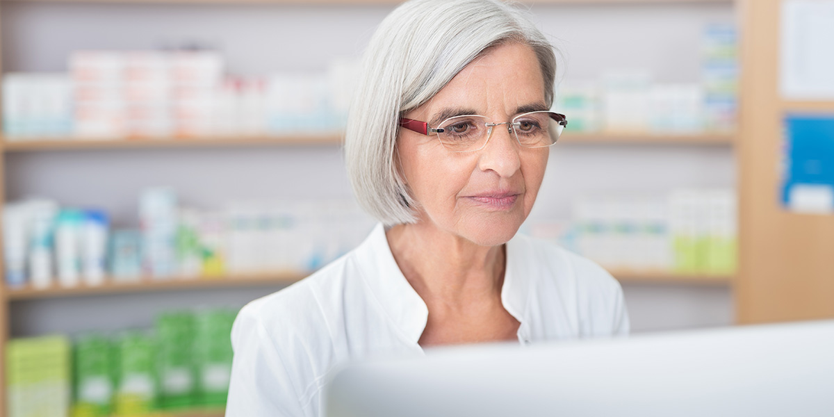 pharmacist looking at a computer screen