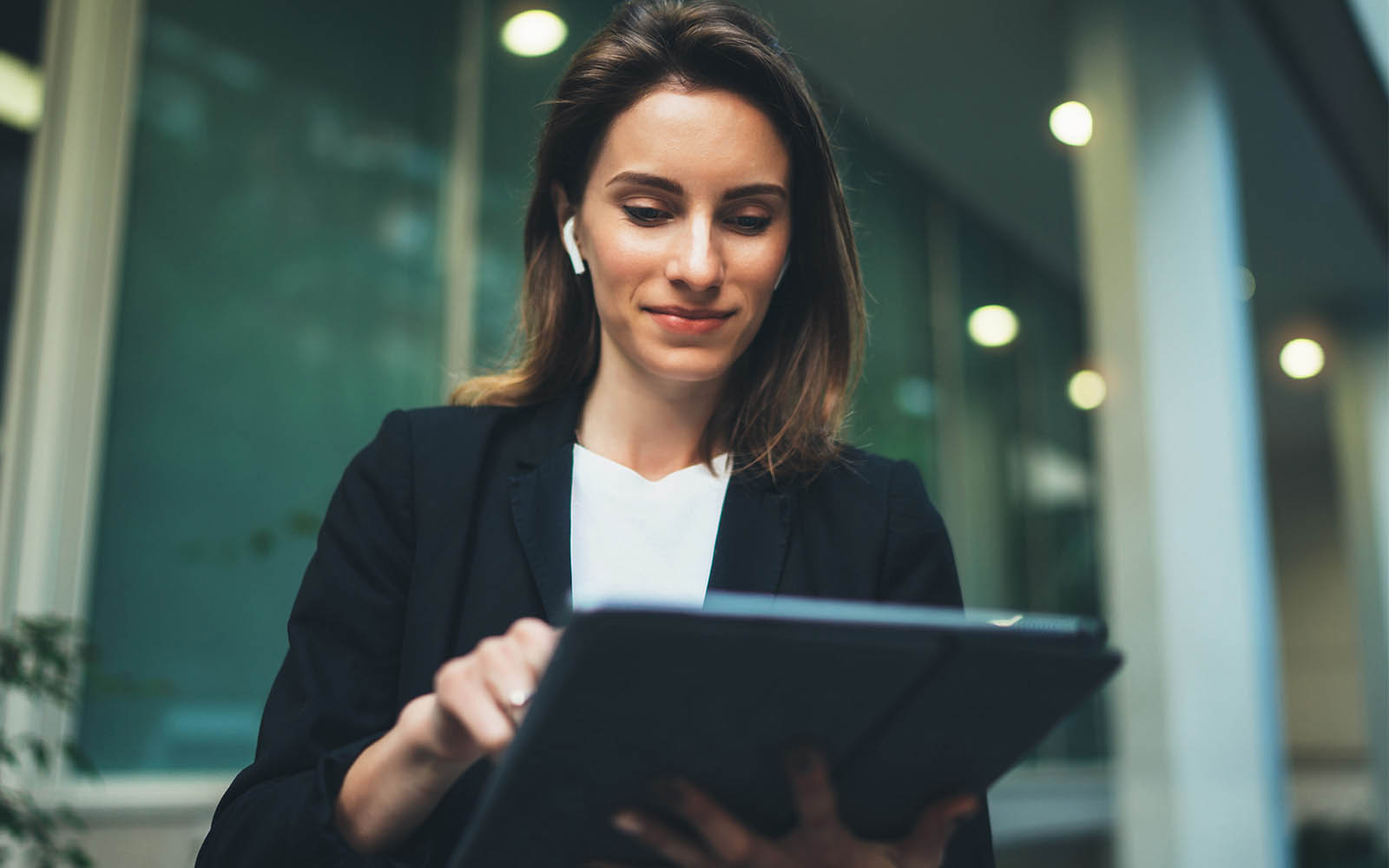 Professional financial lawyer standing in front of an office on street communicating online